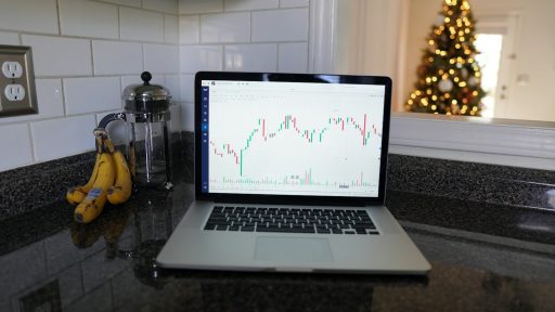 macbook pro on black table