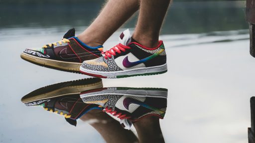 person wearing black red and white nike sneakers