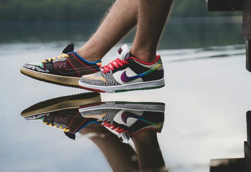person wearing black red and white nike sneakers