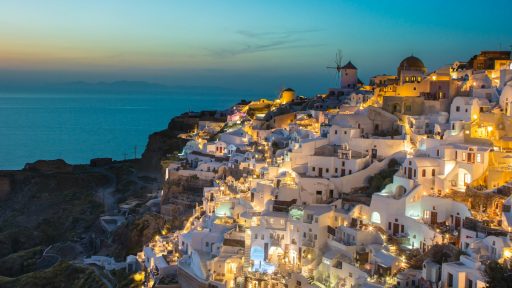 white and brown concrete houses on mountain near sea during daytime